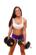 Portrait of muscle woman posing in studio with dumbbells