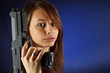 Young girl holding gun