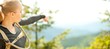 outdoor panoramatic shot of young beautiful woman pointing