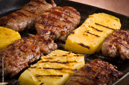 Foto: Sausage and sliced of polenta Sausage and sliced of polenta