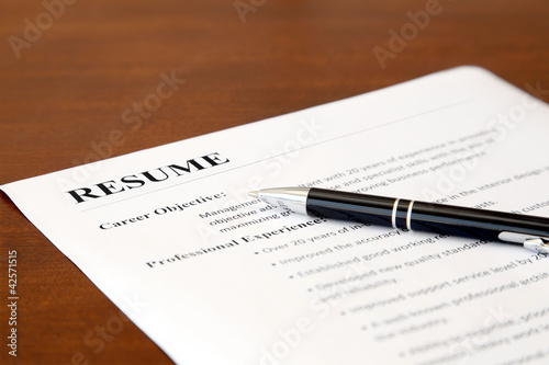 Photo: Closeup of Resume with Pen on the Table Closeup of Resume with Pen on the Table