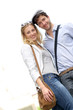 Portrait of lovely couple standing outside