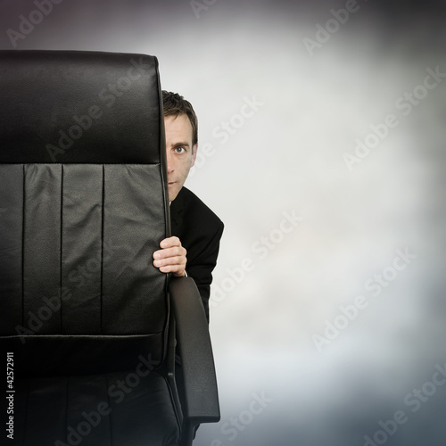 Photo: hiding businessman hiding businessman
