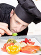 Photo: chef decorating delicious fruit plate chef decorating delicious fruit plate