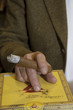 Cropped image of hands holding burning cigar