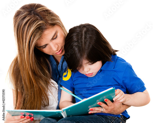 Photo: Boy coloring with his mother Boy coloring with his mother