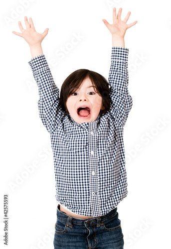 Photo: Excited boy with arms up Excited boy with arms up
