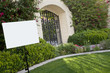 Photo: Sign board on lawn with house in background Sign board on lawn with house in background