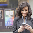 Young Woman with cell phone walking