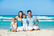 Family having fun on tropical beach