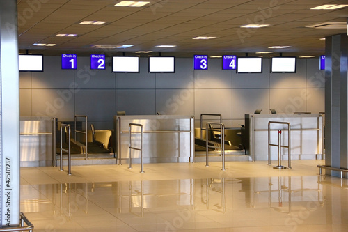 Photo: Modern interior of airport terminal check-in Modern interior of airport terminal check-in