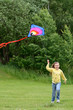 Child girl runs with kite
