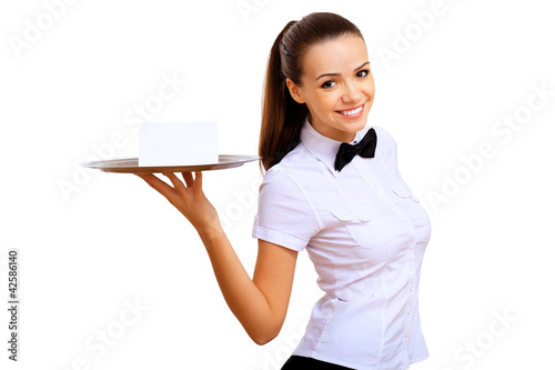 Foto: Young waitress with an empty tray Young waitress with an empty tray