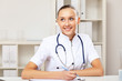 Photo: Young female doctor in white uniform Young female doctor in white uniform