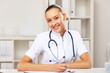 Photo: Young female doctor in white uniform Young female doctor in white uniform
