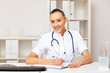 Photo: Young female doctor in white uniform Young female doctor in white uniform