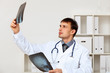 Young male doctor in white uniform