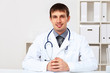Young male doctor in white uniform