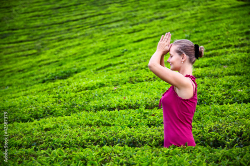 Photo: Praying woman in tea plantations Praying woman in tea plantations