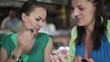 Video: Two female friends applying beauty make-up in the cafe Two female friends applying beauty make-up in the cafe