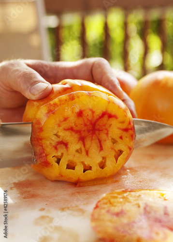 Photo: Slicing Tomatoes for Dinner on Back Porch Slicing Tomatoes for Dinner on Back Porch