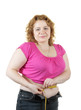 unsightly woman measuring waist with tape measure