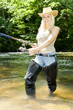woman fishing in river