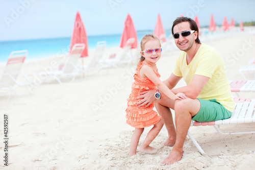 Photo: Father and daughter at resort beach Father and daughter at resort beach