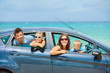 Family of four driving in a car