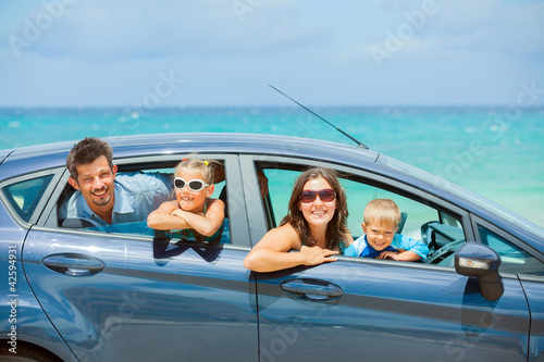Photo: Family of four driving in a car Family of four driving in a car
