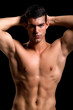 Photo : Healthy muscular young man. Isolated on black background. Healthy muscular young man. Isolated on black background.