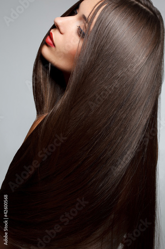 Photo: Woman with smooth hair. High quality image. Woman with smooth hair. High quality image.