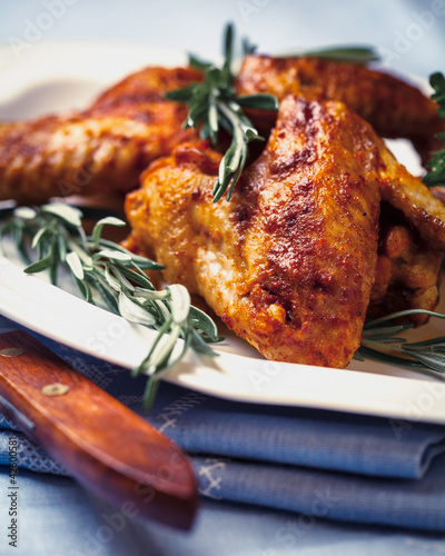 Photo: Chicken wings with rosemary sprigs Chicken wings with rosemary sprigs