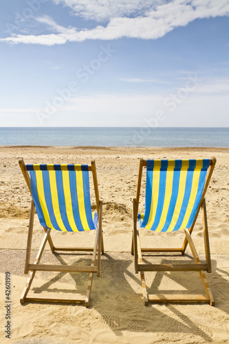 Foto: Two deck chairs on the beach Two deck chairs on the beach