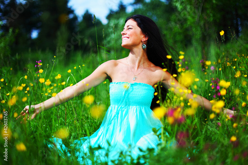 Photo: woman on summer flower field woman on summer flower field