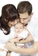 Parents kissing newborn baby, Family love