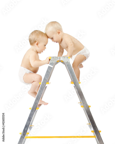 Photo: babies climbing on stepladder and fighting for first place babies climbing on stepladder and fighting for first place