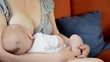 Mother breastfeeding her newborn baby