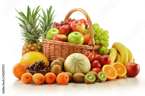 Photo: Composition with assorted fruits in wicker basket Composition with assorted fruits in wicker basket