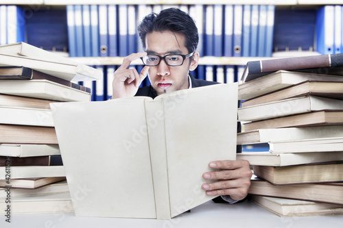 Photo: Analyzing business books Analyzing business books