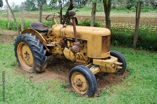 Photo: Yellow farm tractor Yellow farm tractor