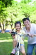 Father with two little girls on the bicycle