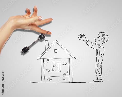 Foto: Man and house with a key Man and house with a key