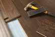 Photo: Hammer and Block with New Laminate Flooring Hammer and Block with New Laminate Flooring