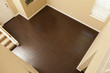 Photo: Newly Installed Brown Laminate Flooring and Baseboards in Home Newly Installed Brown Laminate Flooring and Baseboards in Home