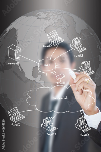 Photo: Businessman write LAN diagram on the whiteboard. Businessman write LAN diagram on the whiteboard.
