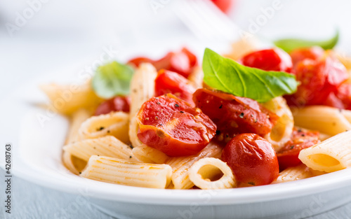 Photo: Penne pasta with cherry tomatoes and basil Penne pasta with cherry tomatoes and basil