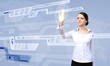 Foto: Businesswoman and touch screen technology Businesswoman and touch screen technology