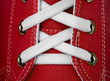 Photo: White lace on red sneakers White lace on red sneakers