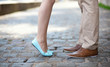 Foto: Closeup of male and female legs during a date Closeup of male and female legs during a date